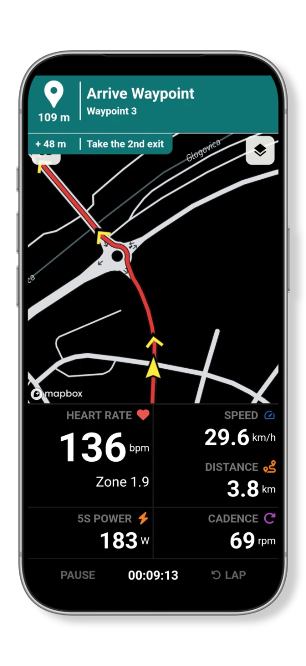 Turn-by-turn navigation showing an upcoming roundabout instruction above the route map and live ride metrics